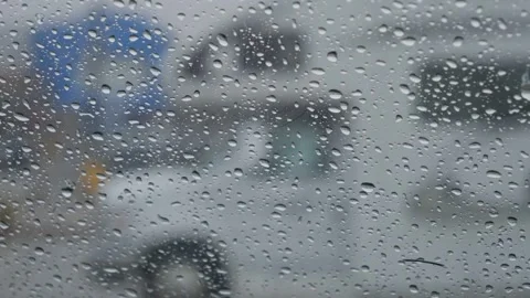 Rainy car window with camper van in background Stock Footage 303254704