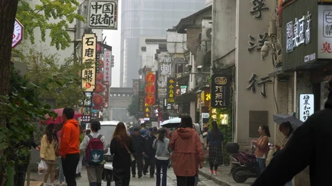 Rainy changsha old pedestrian crowded street slow motion panorama 4k china Stock Footage 148497513