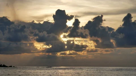 Rainy cloud sky with sunlight over the sea at evening time Stock Footage 132019583