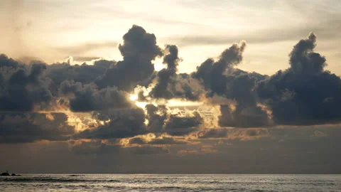 Rainy cloud sky with sunlight over the sea at evening time Stock Footage 132019594