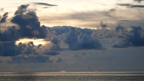 Rainy cloud sky with sunlight over the sea at evening time Stock Footage 132019739