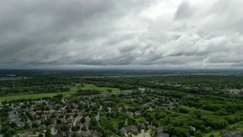 Rainy clouds above -  over a small town 스톡 동영상 338224935