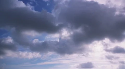 Rainy clouds flying across the blue sky Video stock 921710