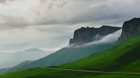 Rainy clouds in the mountains at sunset timelapse. Stock-Footage 219569684