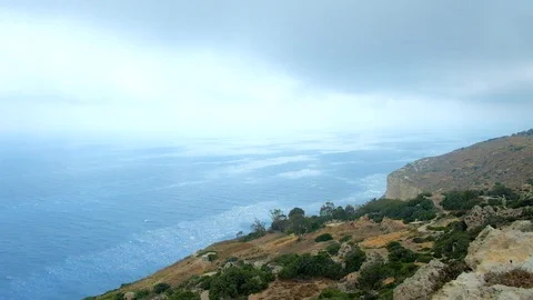 Rainy clouds over the Dingli Cliffs, Malta Stock Footage 96577820