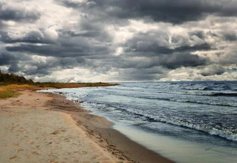 Rainy clouds over the lake Stock Photos