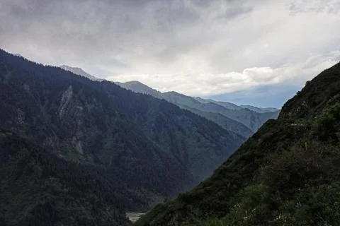 Rainy clouds over the mountains. perspective view Stock Photos