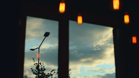 Rainy clouds seen through window. White fluffy clouds moving on sky view through Stock Footage 251732217