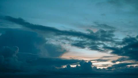 Rainy clouds at sunset in autumn Stock Photos
