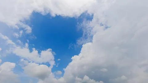 Rainy clouds under the blue sky a 写真素材