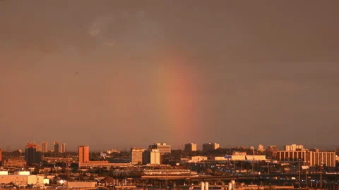 Rainy cloudy rainbow glow sky sunset Video stock 199699692
