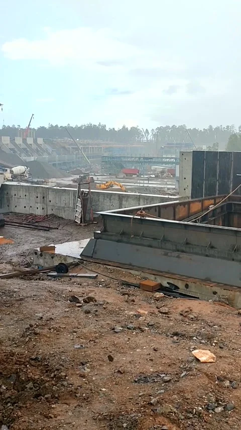 Rainy Crane Cabin View of Two Dump Trucks and Conveyor Stock Footage 340384512