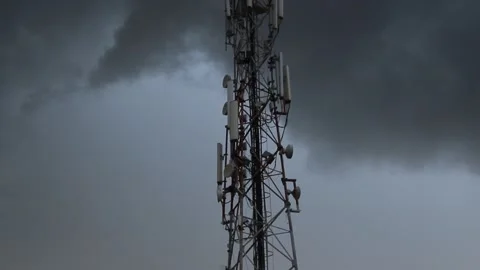 Rainy dark clouds surrounding a Telecommunication tower on winter season 動画素材 162962001