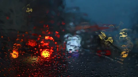 Rainy dark night view from inside the car, with flashher.defocused bokeh. Stock Footage 128544382