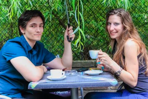 Rainy date for a young couple Stock Photos