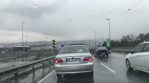 Rainy day and crossing the Haliç Golden Horn Bridge in traffic Stock Footage 232164436