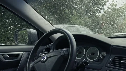Rainy Day Car Interior Shows Steering Wheel, Dashboard, Rearview Mirror, Stock Footage 273832598