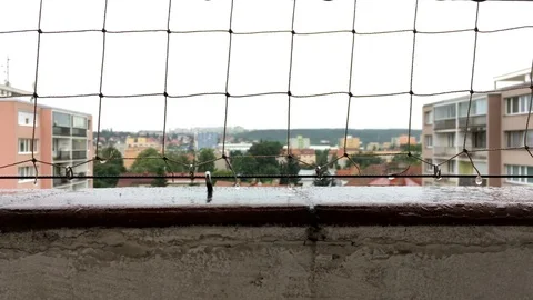 Rainy day. Close-up view from balcony Stock Footage 77908679