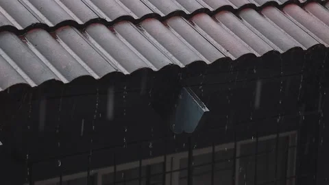 Rainy Day Concept. Rain Falling into the Roof House. Static and Handheld Stock Footage 132568897