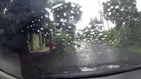Rainy day drive with raindrops on windshield Stock-Footage 279718860