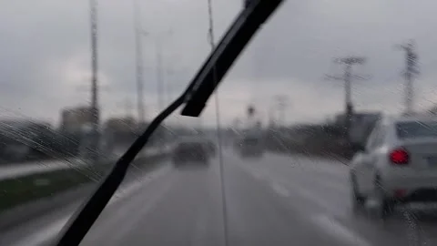 Rainy Day Drive Seen from Car Dashboard with Windshield Wipers in Motion Stock Footage 314195095