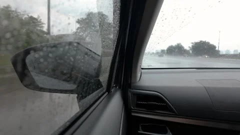 Rainy day drive through blurred windshield Видео 317886202