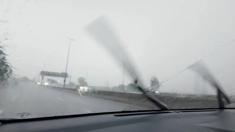Rainy day drive through blurred windshield 库存影片 317886209