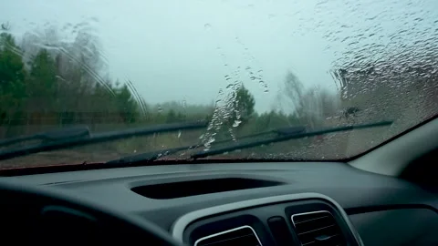 A Rainy Day Inside a Car: Capturing the Peaceful Quietness of a Drizzly 스톡 동영상 333366511