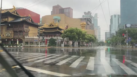 The rainy day intersection in Shanghai under lockdown Stock Footage 197112812