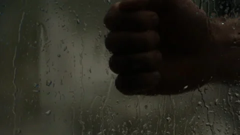 On a rainy day, a man knocks on the door.The door opens.Rain on the street Stock Footage 106891690