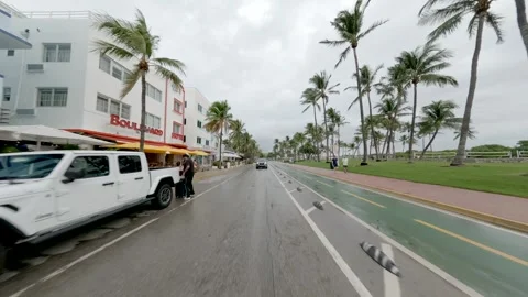 Rainy day in Miami driving on Ocean Drive rear view plates Stock Footage 287640227
