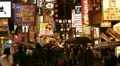 Rainy Day People Walking Rain Umbrella Illuminated Night Osaka Shopping Street HD Footage