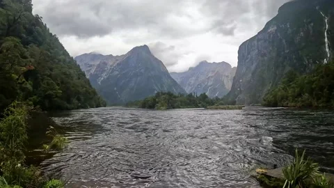 Rainy Day at Sandfly Point: Dramatic Waterfalls Cascading from Lush Cliffs .. Stock Footage 295247747