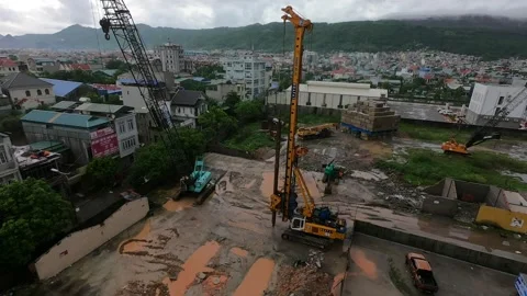 Rainy day time lapse construction site in a mountain town 스톡 동영상 167249300