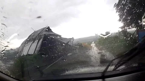 Rainy day view from inside a car with damaged structure outside Stock Footage 279717594