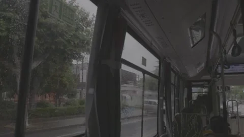 Rainy Day View from Moving Bus Window - Interior Perspective.vlog Stock Footage 339369347