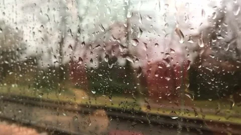 Rainy Day View Through a Train Window Stock Footage 335694487