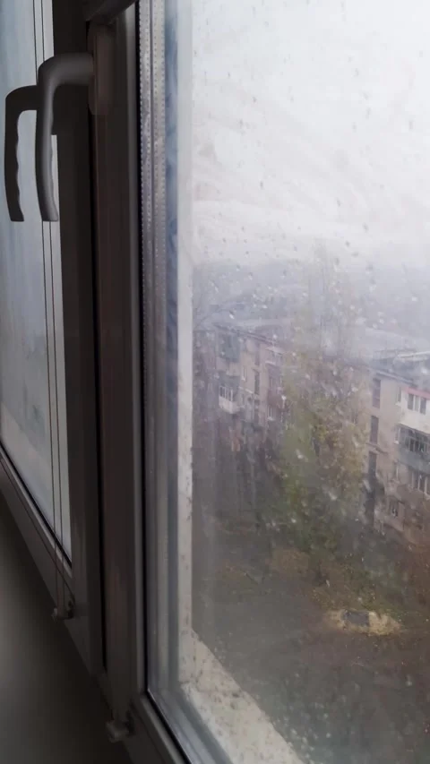 Rainy Day View Through a Wet Window Pane Stock-Footage 325223565