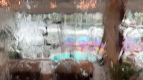 Rainy day water drops falling on a wet glass window Stock Footage 318282537