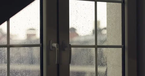 Rainy day, water drops running down the window glass at rainy day Stock Footage 256932988