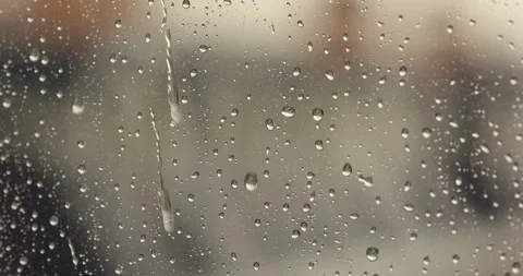 Rainy day, water drops running down the window glass at rainy day. Close up Stock Footage 256934337