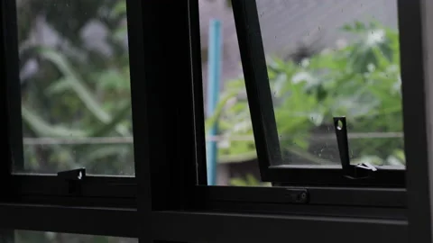 Rainy day on window house background with green tree forest Stock Footage 164575783