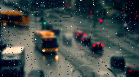 Rainy days, Rain drops on window with blurred traffic ,rainy weather, Stock Footage 53830328