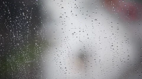 Rainy days, Rain drops on window with blurred traffic ,rainy weather, Stock Footage 53839766
