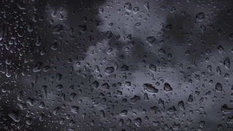 Rainy days, rain drops on window surface Video stock 73331944