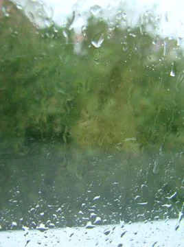 Rainy days rain drops on the window surface Stock Photos