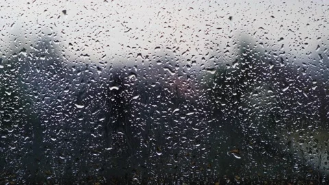 Rainy days,rain drops on the window surface Video stock 136567347
