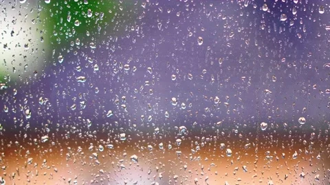 Rainy days,rain drops on the window surface Stock Footage 138457804