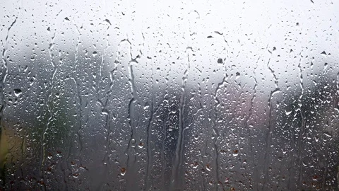 Rainy days,rain drops on the window surface,heavy raining Stock Footage 90662086