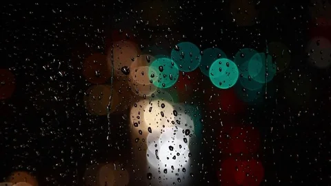 Rainy days,rain drops on the window with traffic bokeh Video stock 69833785